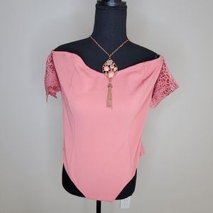 Pink bodysuit with attached lace sleeves